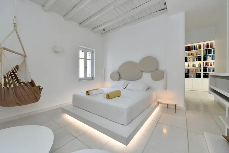 Master bedroom with floating bed and indoor hammock