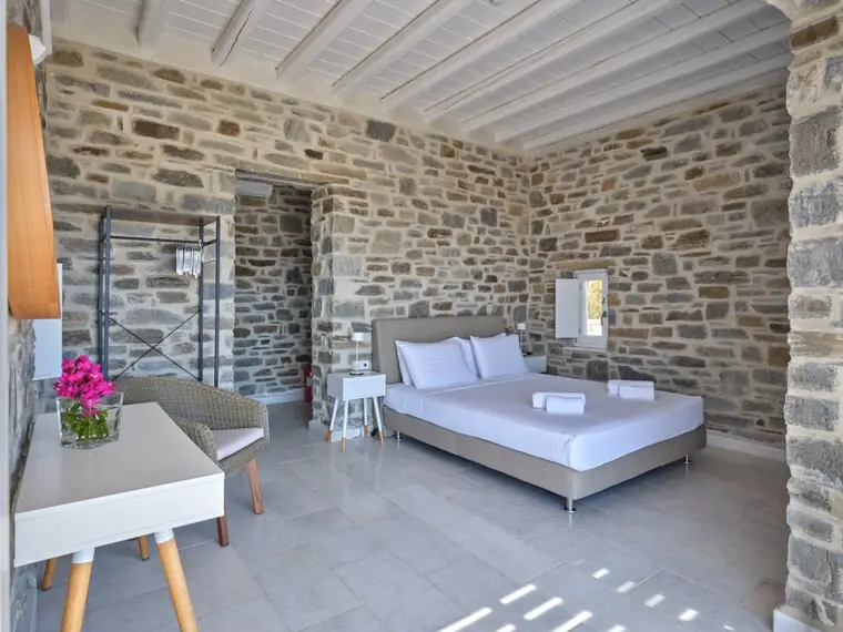 Spacious stone guest-house double bedroom