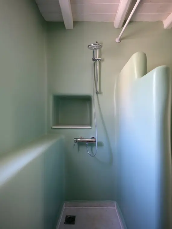 Sculpted pale-green walk-in shower