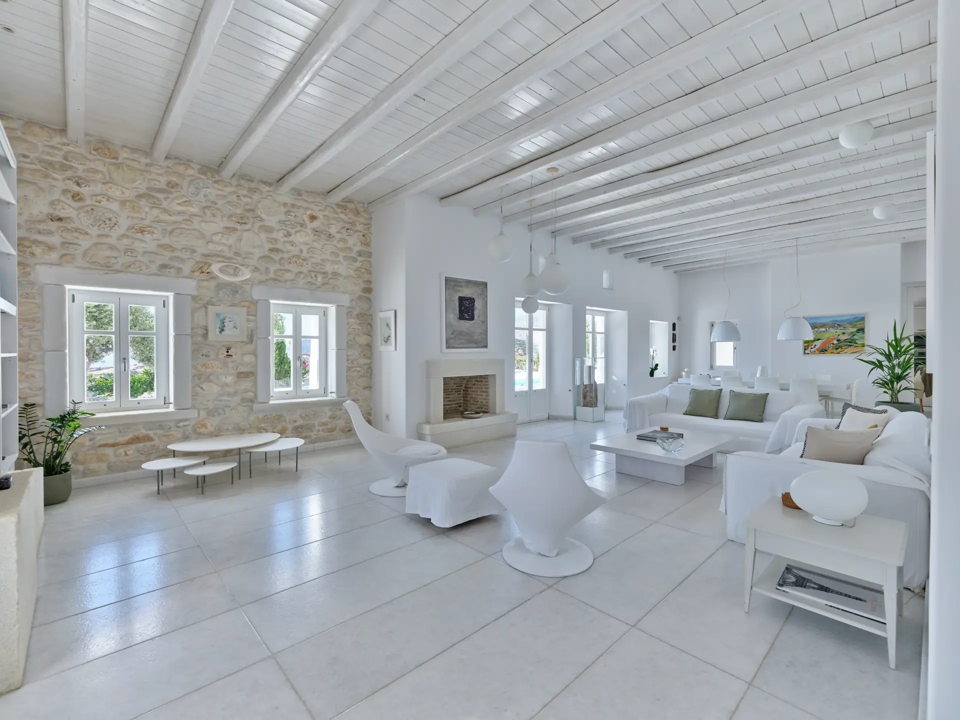 Spacious white dining room at Padel Villa Paros