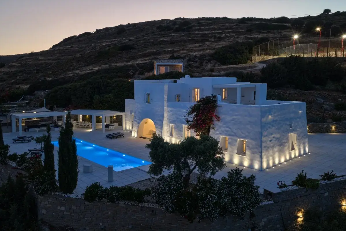 Illuminated Paros villa and pool at night
